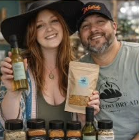 Local Love vendors displaying food and pantry products at the HIVE Market